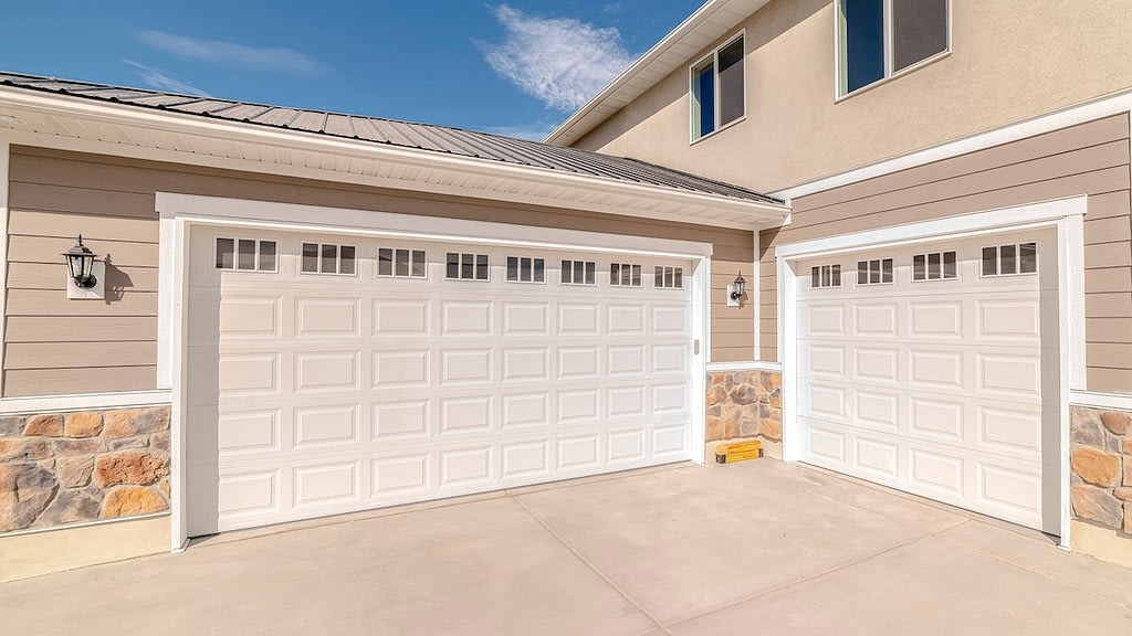Panorama frame Drive way and garage of modern two storey home.