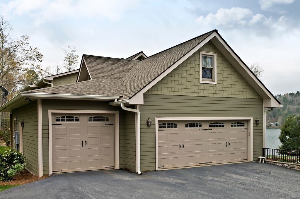 Garage with three stalls, two garage doors one large and one small