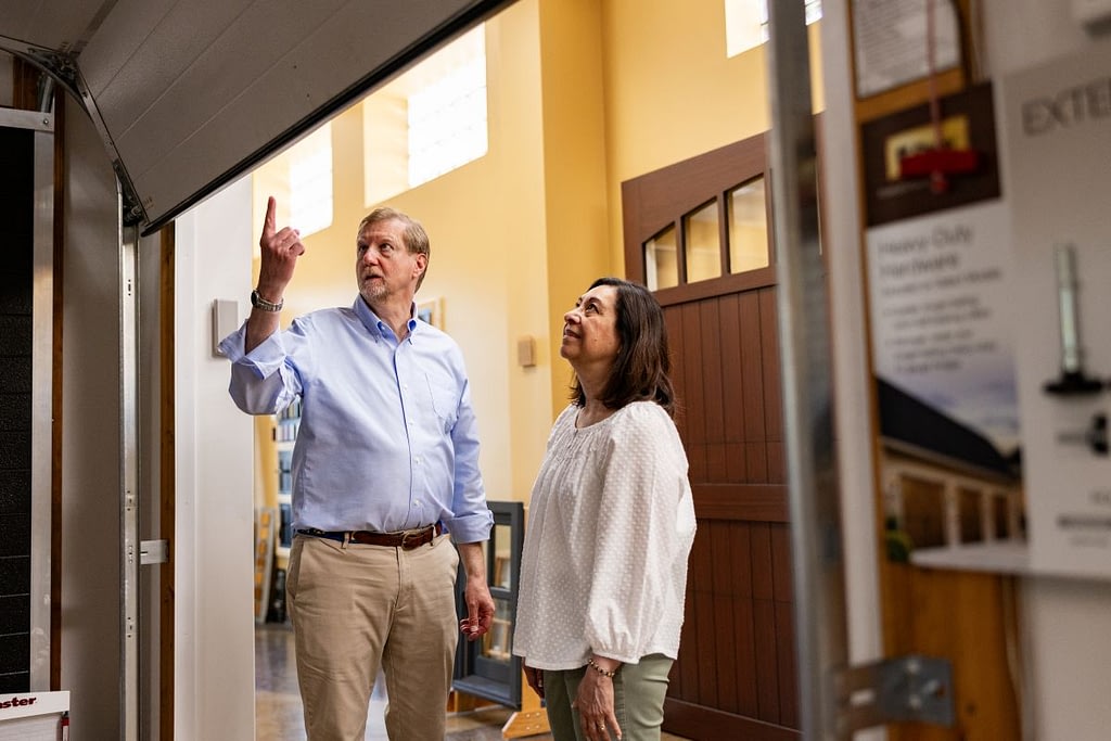 aluminum garage doors Cunningham seller man talking with costumer about doors
