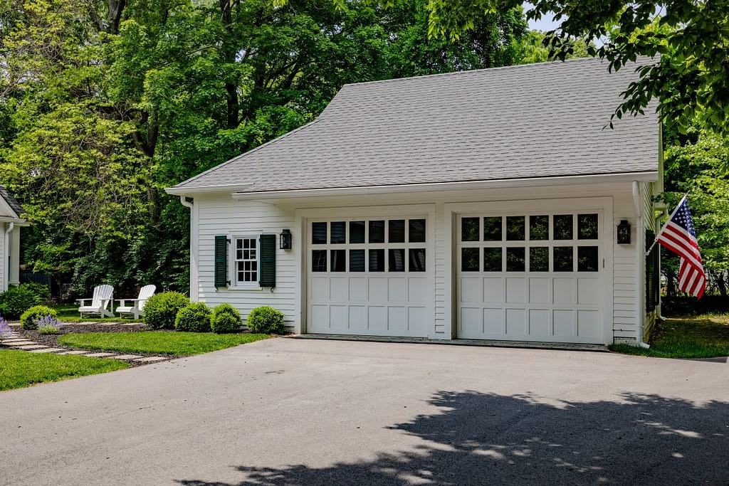 White house and white garage doors with windows