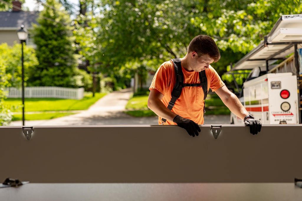 Cunningham worker installing garage door