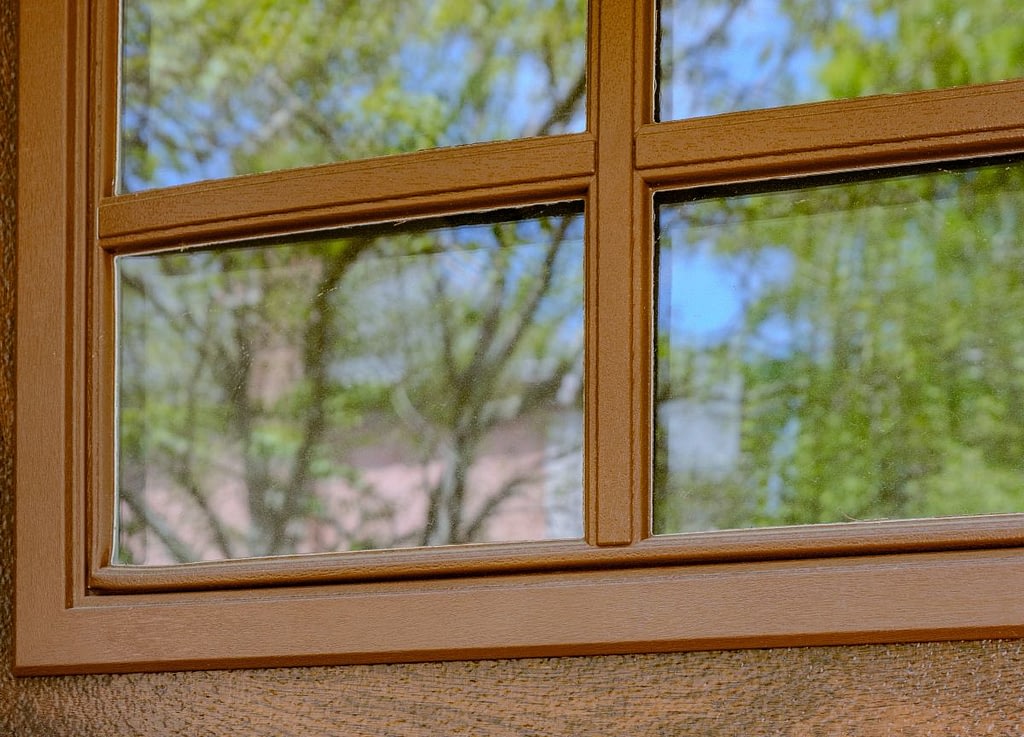 Close-up on a wooden garage door with windows