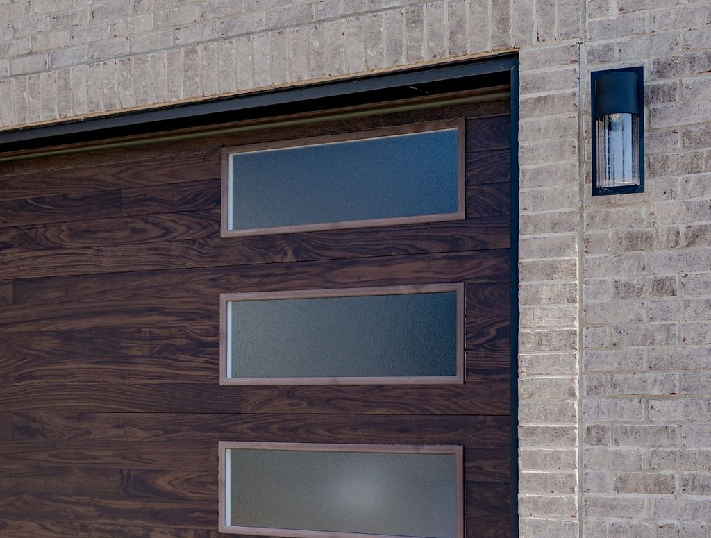Dark wooden garage doors with frosted glass windows