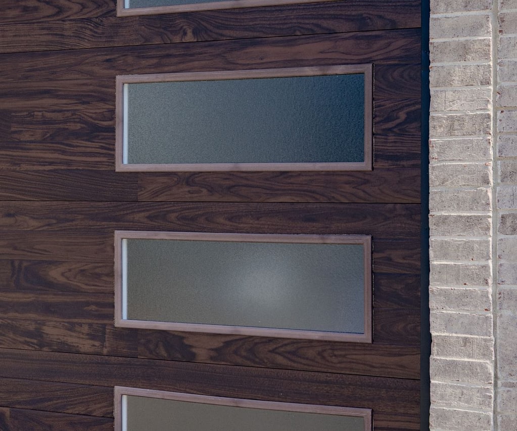 close-up of a brown garage door with frosted windows
