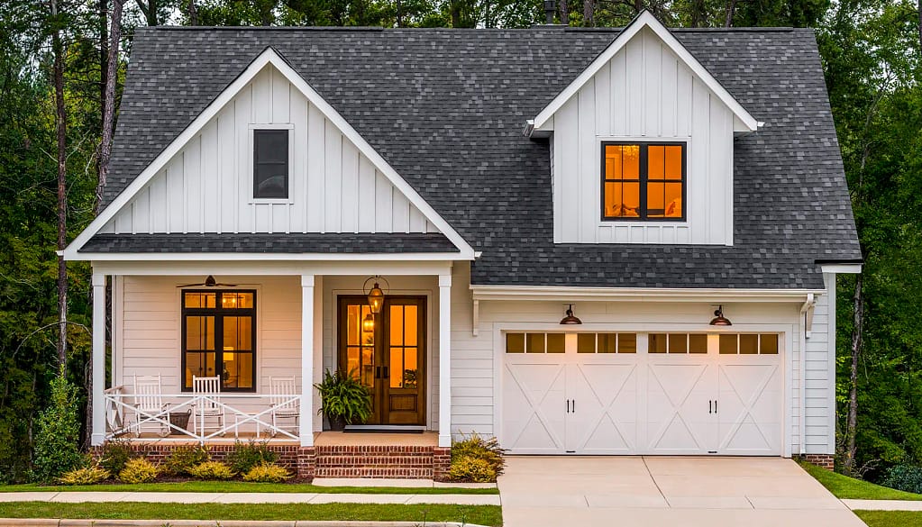 beautfiul white home with new clopay doors