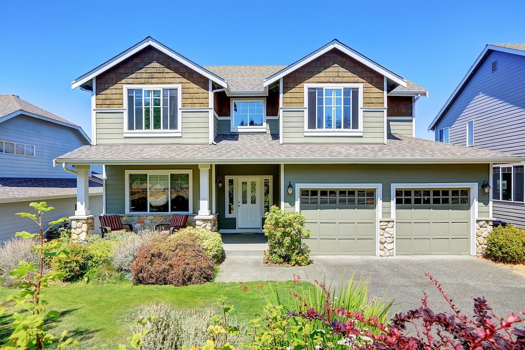 Curb appeal of luxury family house with nice landscape.