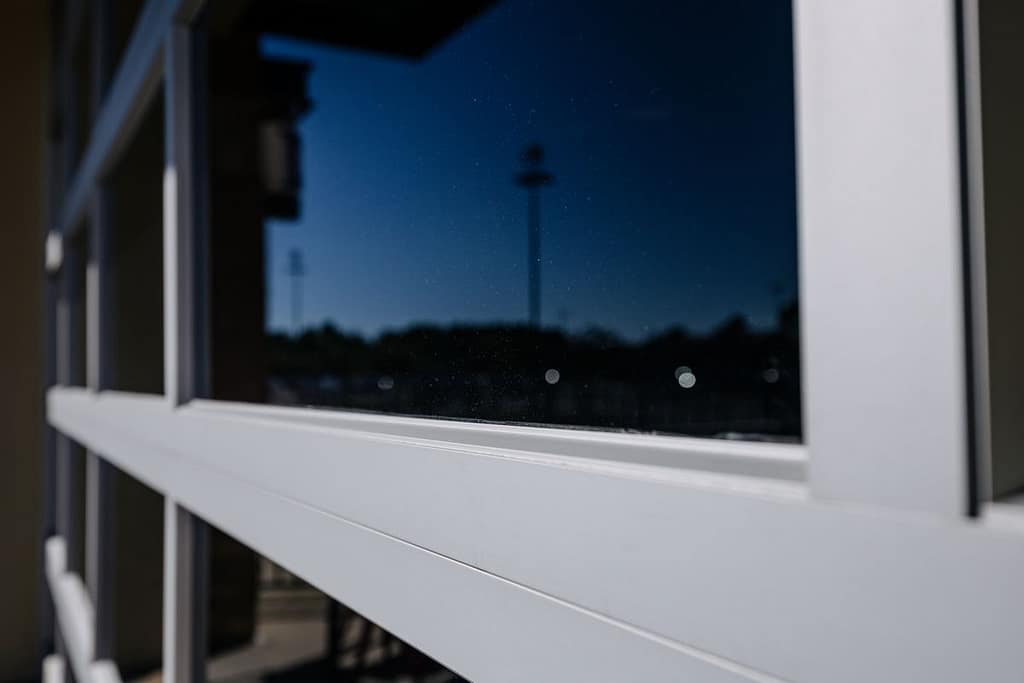 Close-up of a garage door with full-view glass panels
