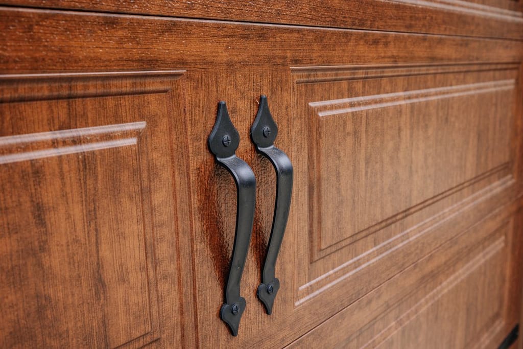 close-up of handles on a wooden garage door