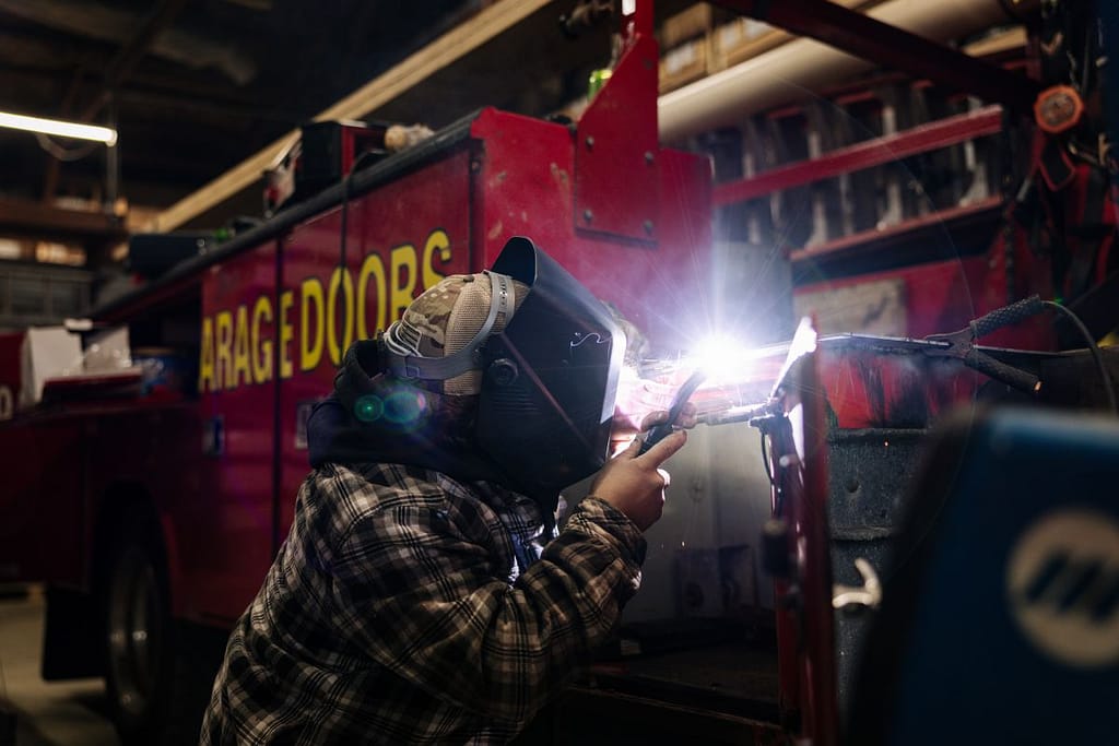 A Giel team member repairing a garage door