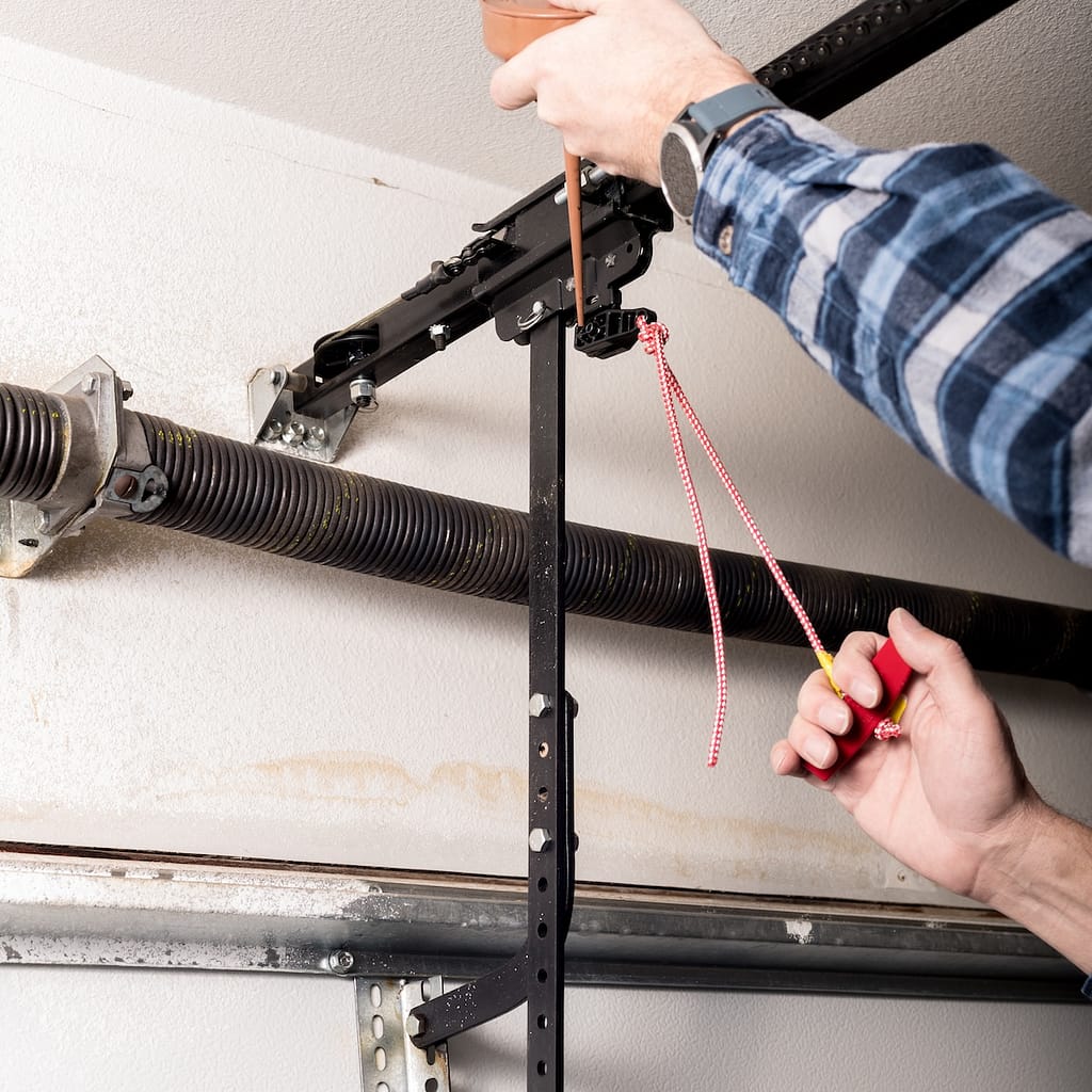 Metal can of oil is used to lubricate a release leaver for a garage door