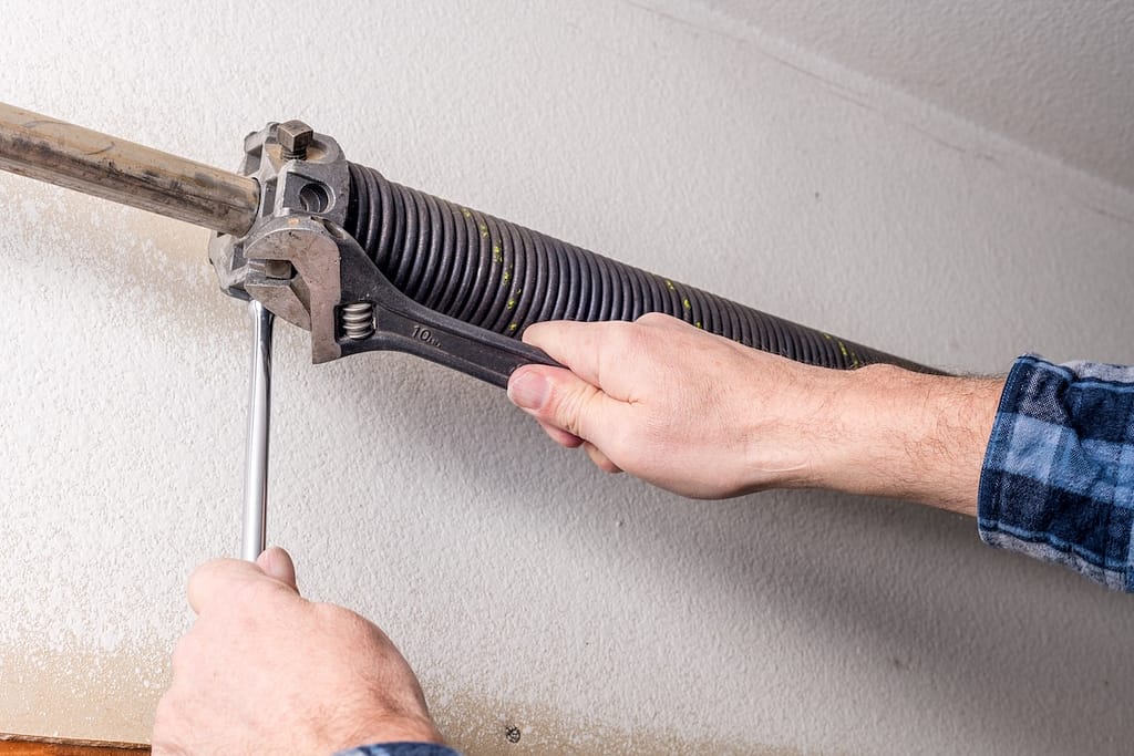Fittings on the end of a garage door spring are twisted
