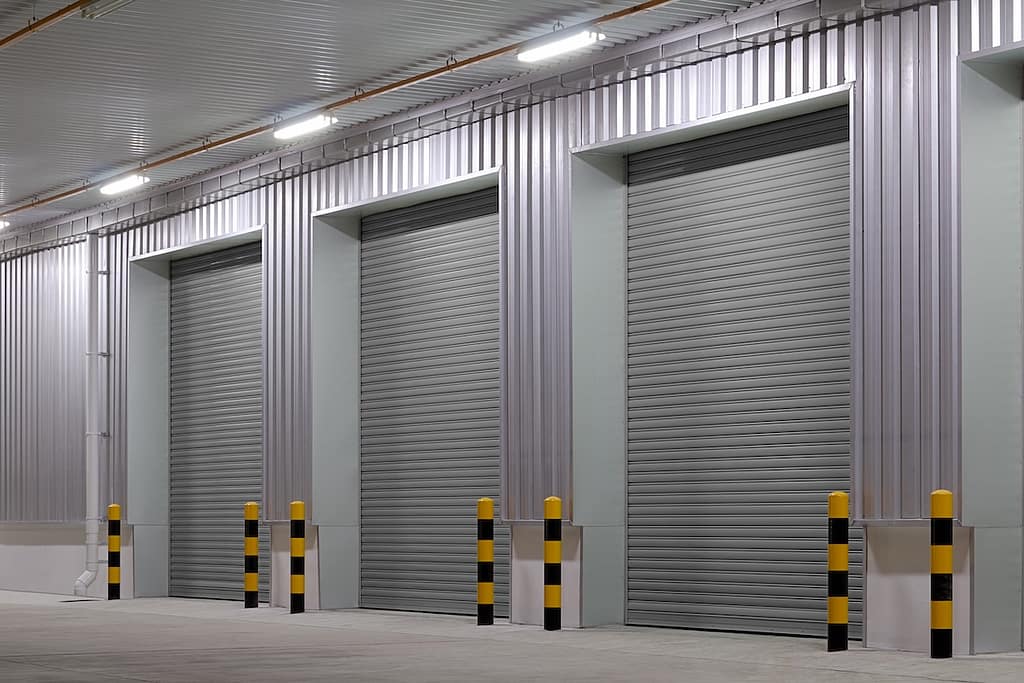 Shutter door or roller door and concrete floor outside factory building use for industrial background.