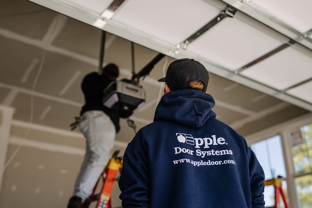 Apple door workers, fixing garage door openers