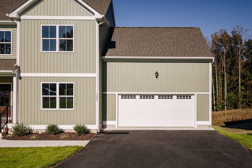 Two story house with a single garage door