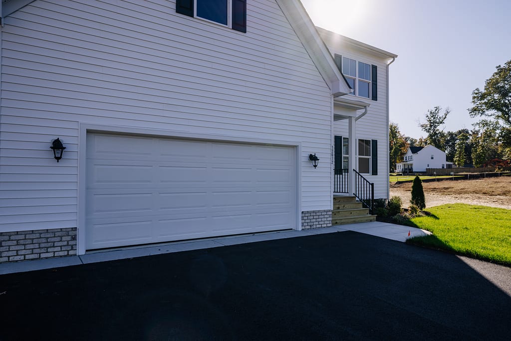 Single door garage, white house