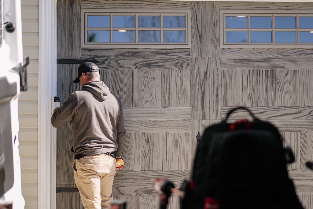 front door with glass panels worker installing new door