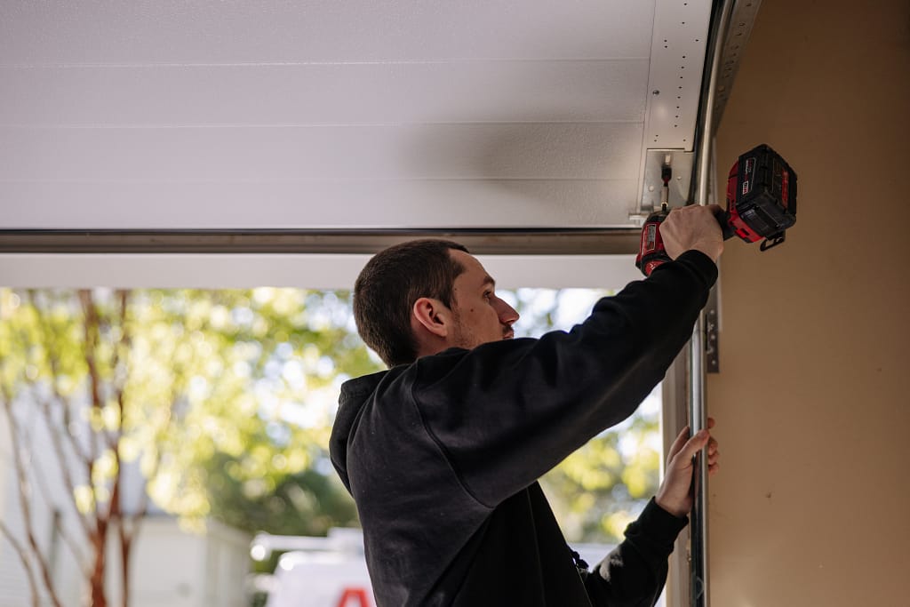 diy garage door repair guy fixing door